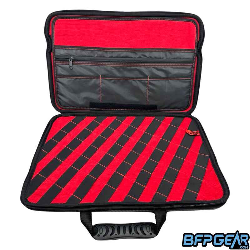 The bottom half of the marker case XL. Multiple pockets to keep tools, oil, or lube inside of. The bottom part has elastic bands that are stitched down which gives you the ability to put a barrel kit in them.