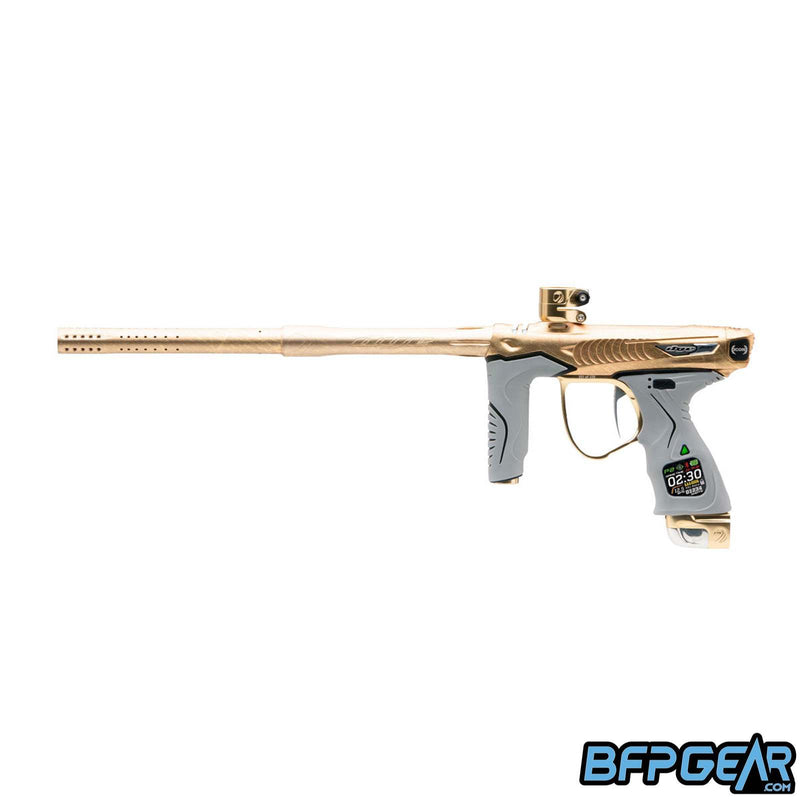 The Dye M3+ Icon 2 paintball marker in Pure Gold Dust PGA. Pure gold pattern looks like textured gold mineral.