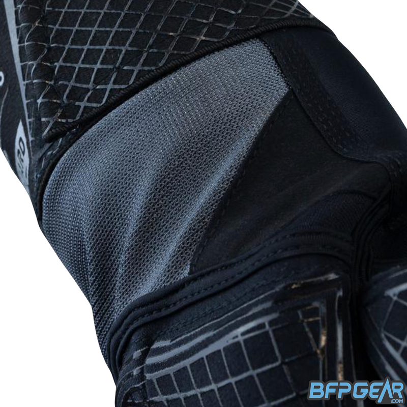 A close up of the flexible material and stitching. A durable and stretchy material prevents rips and tears while playing. There is double stitching throughout the armpad, connecting different materials together.
