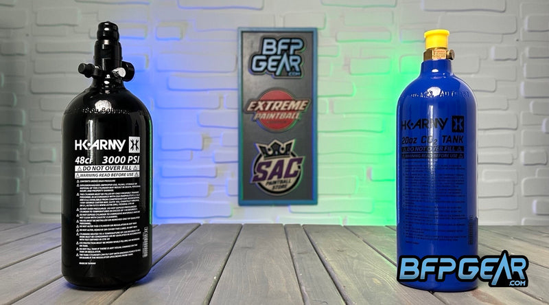 From left to right: HK Army 48ci aluminum air tank, and next to it is a blue HK Army 20oz CO2 tank.