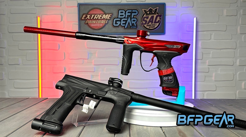 Pictured here are two paintball markers. The DYE M3+ and the Planet Eclipse Etha 3M, showing the difference between an electronic marker and a mechanical marker.