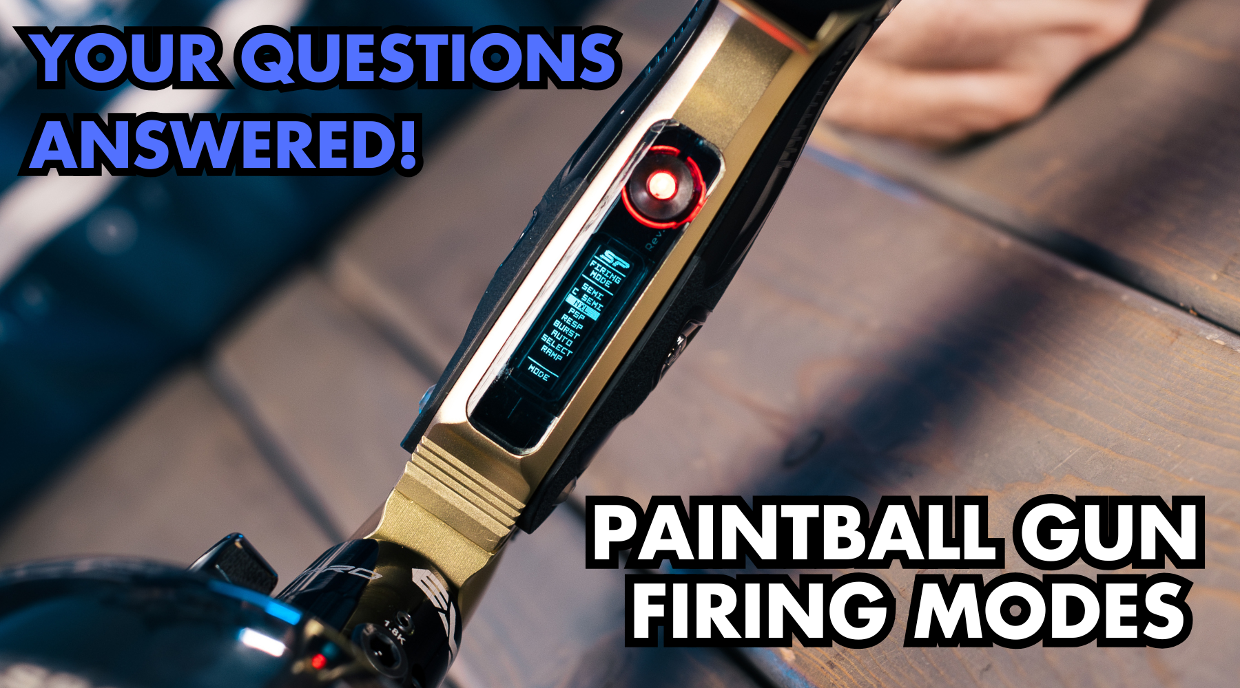 Paintball player adjusting firing modes on an electronic paintball gun – semi-auto, burst fire, ramping, response, and full-auto explained.