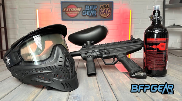 Pictured here is an entry level paintball package. From left to right: HK Army HSTL goggles, Lippmann Stormer with a gravity loader, and a JT 48ci air tank.
