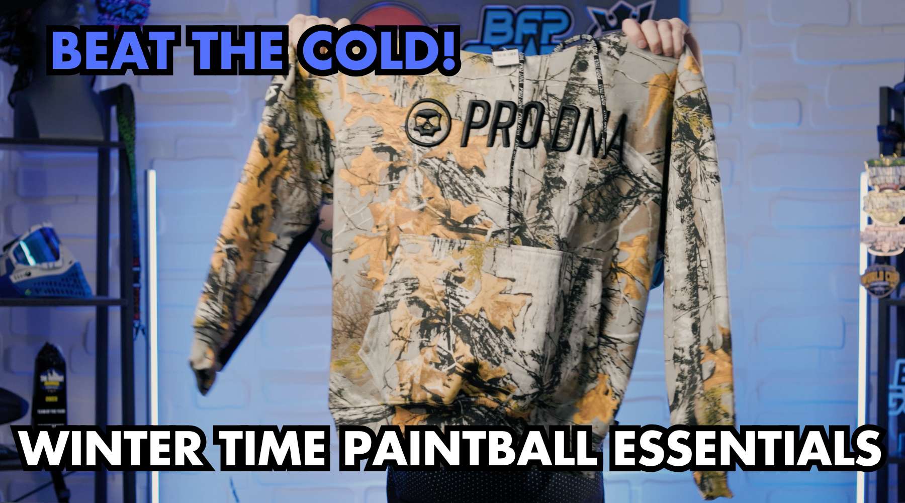 Winter paintball gear essentials including hoodie, gloves, compression pants, and beanie for cold-weather gameplay.