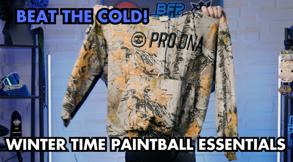 Winter paintball gear essentials including hoodie, gloves, compression pants, and beanie for cold-weather gameplay.