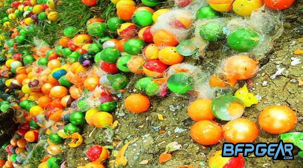 A picture of paintballs on the ground. Paintballs are biodegradable and eventually dissolve into the ground