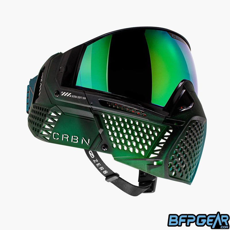 The left side of the Fade Forest CRBN Zero goggle. This half is dark green with some lighter green splashed in.