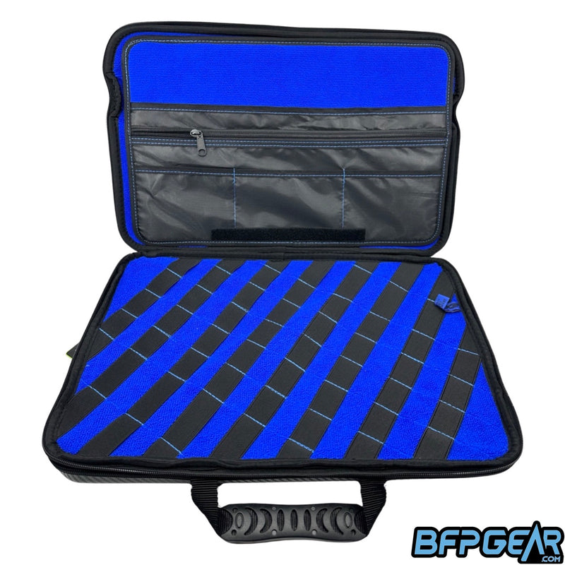 The bottom half of the marker case XL. Multiple pockets to keep tools, oil, or lube inside of. The bottom part has elastic bands that are stitched down which gives you the ability to put a barrel kit in them.