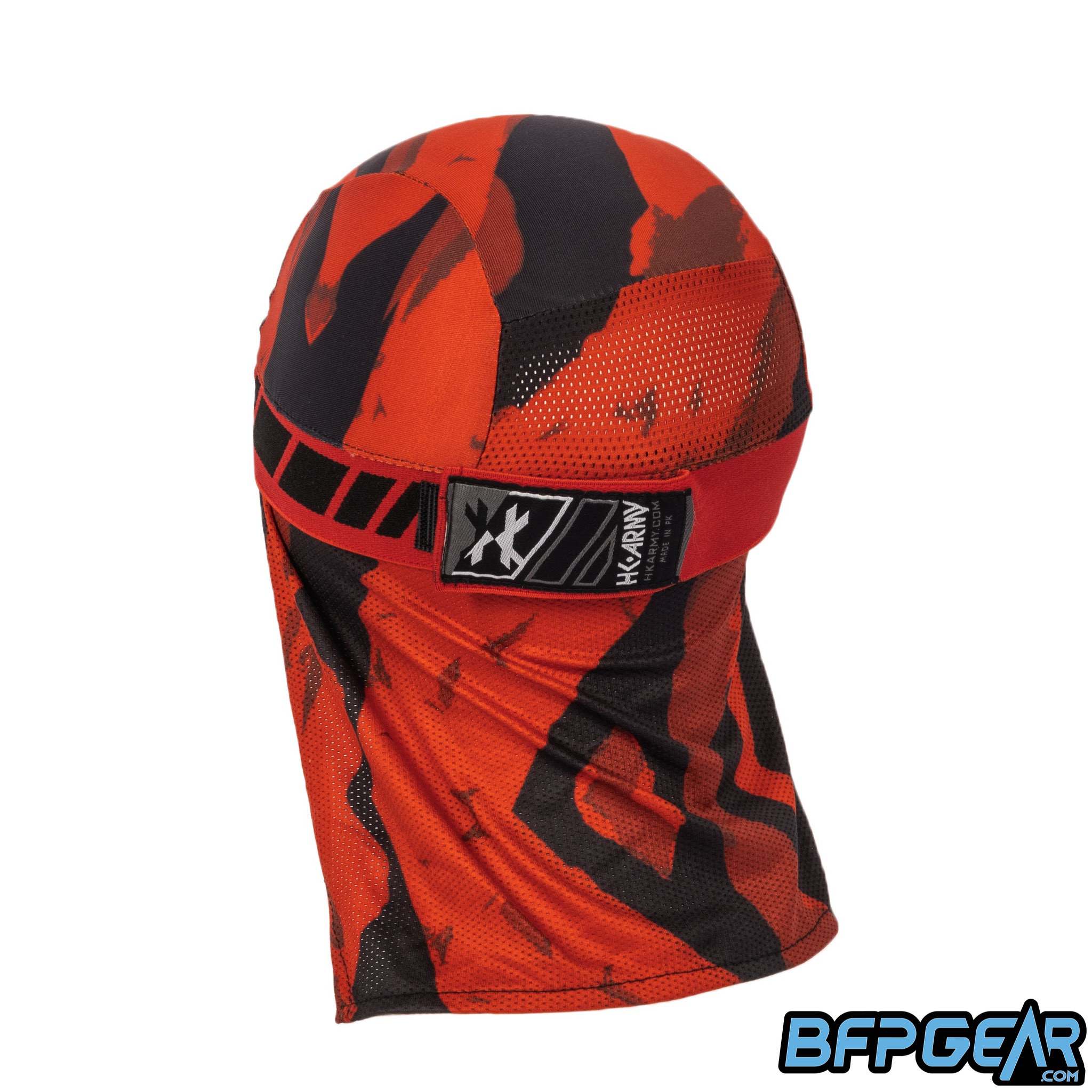 An angled view of the back of the skull cap in the Blaze color way. The elastic band secures firmly with velcro, and shows off an HK Army tag on the back. The mesh lining goes from the apex of the back of your head down over your neck for the best ventilation. The retro pattern goes all around the elastic band.