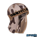 An angled shot of the Sandstorm Skull Wrap. Black HK ARMY logo is stitched into the tan elastic band.