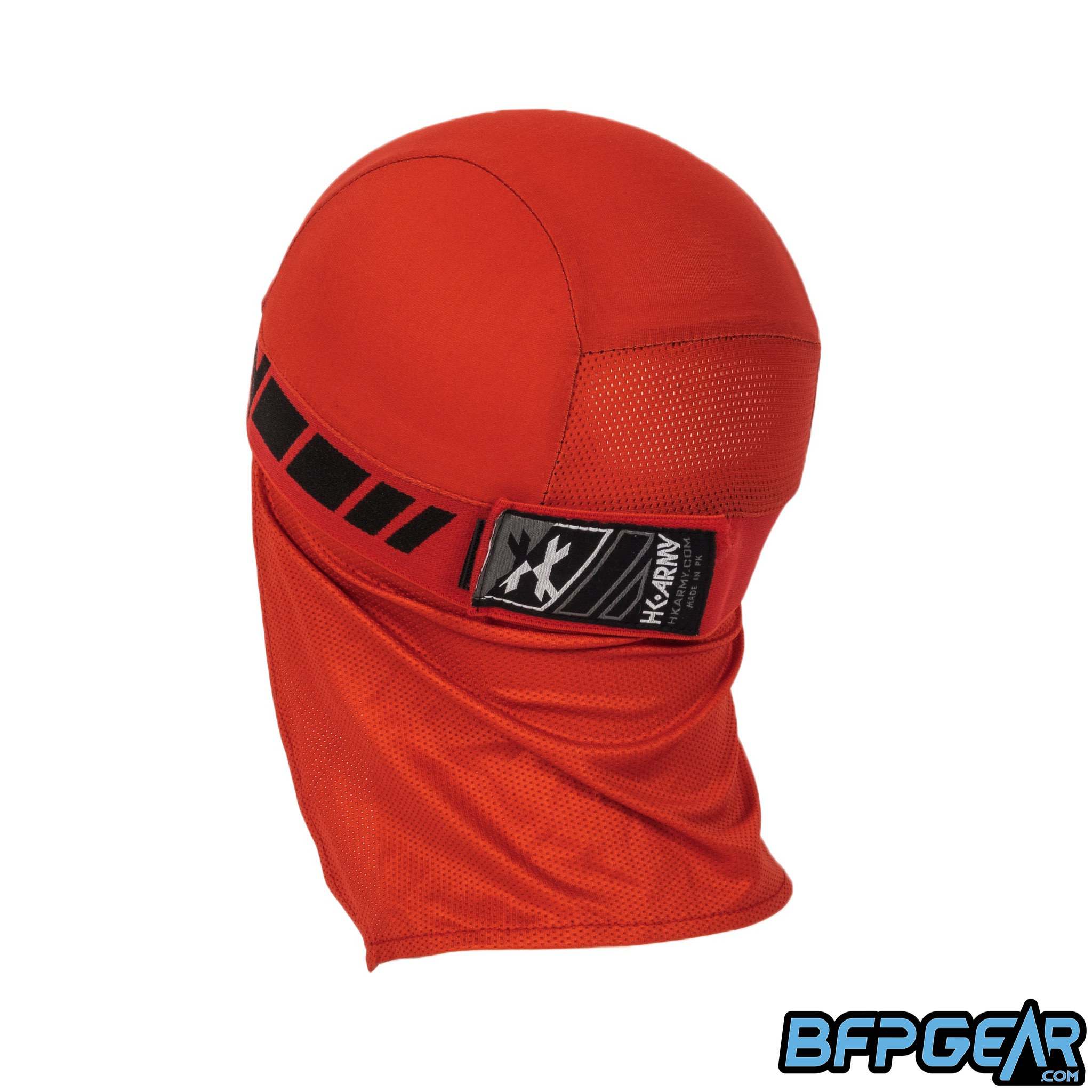 An angled view of the back of the skull cap in the Scorch color way. The elastic band secures firmly with velcro, and shows off an HK Army tag on the back. The mesh lining goes from the apex of the back of your head down over your neck for the best ventilation. The retro pattern goes all around the elastic band.