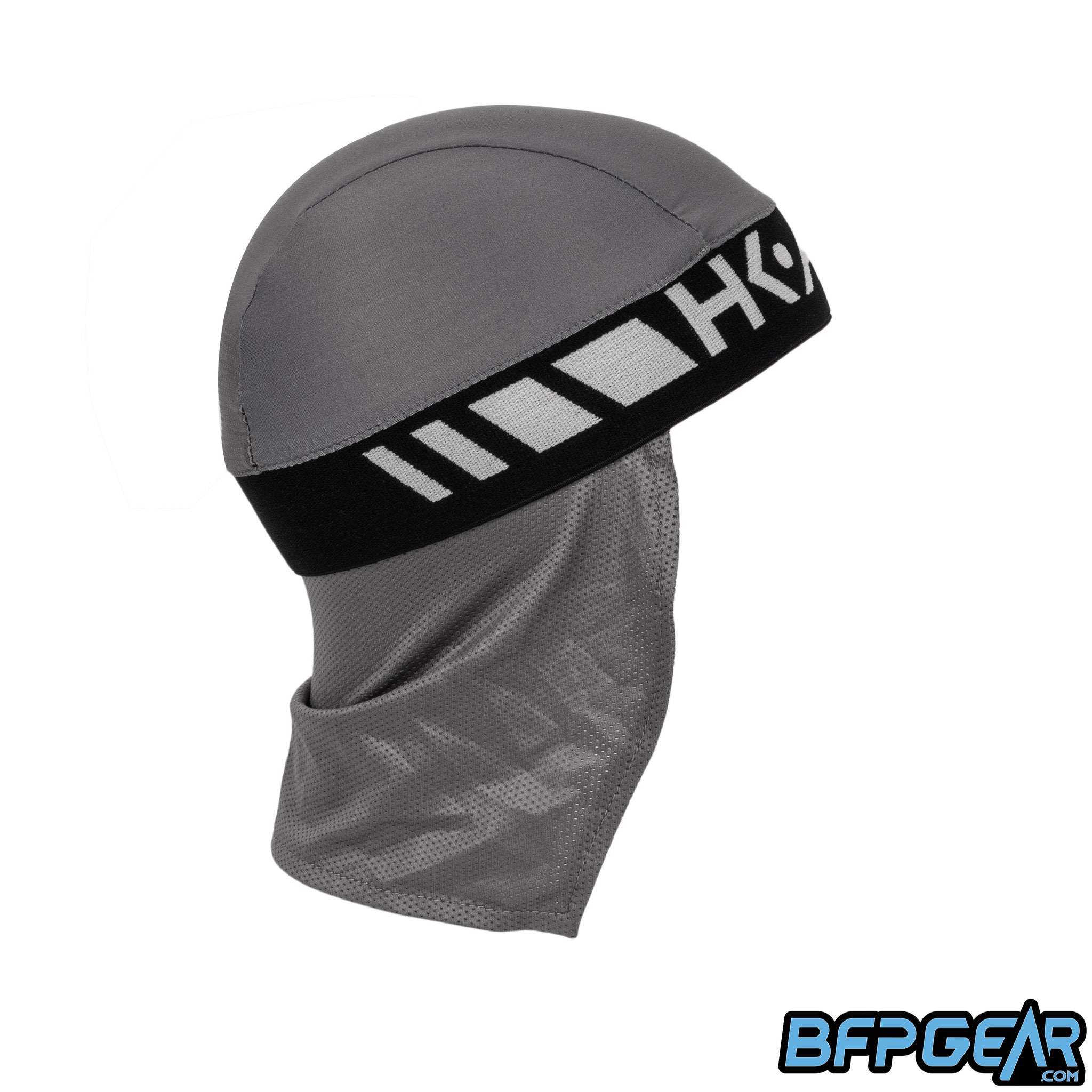 Side view of the Skull Cap in the Slate color way. Mesh lining drapes down the back of the neck to help keep you warm in the cold weather, or to block the sun during hot weather. Elastic band to keep the skull cap secured on you for minimal to zero movement. The elastic band is all black.
