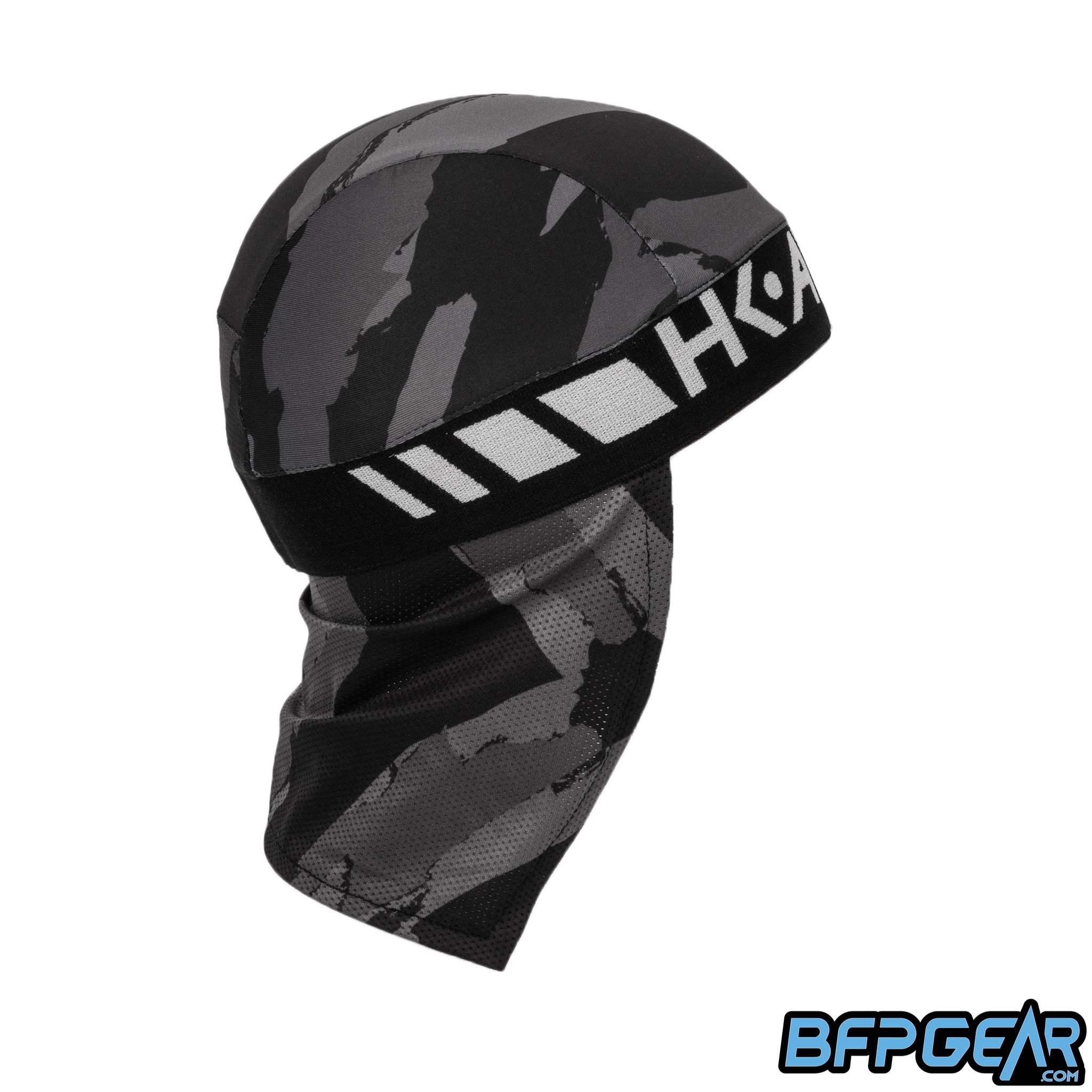 Side view of the Skull Cap in the Smoke color way. Mesh lining drapes down the back of the neck to help keep you warm in the cold weather, or to block the sun during hot weather. Elastic band to keep the skull cap secured on you for minimal to zero movement. The elastic band is all black.