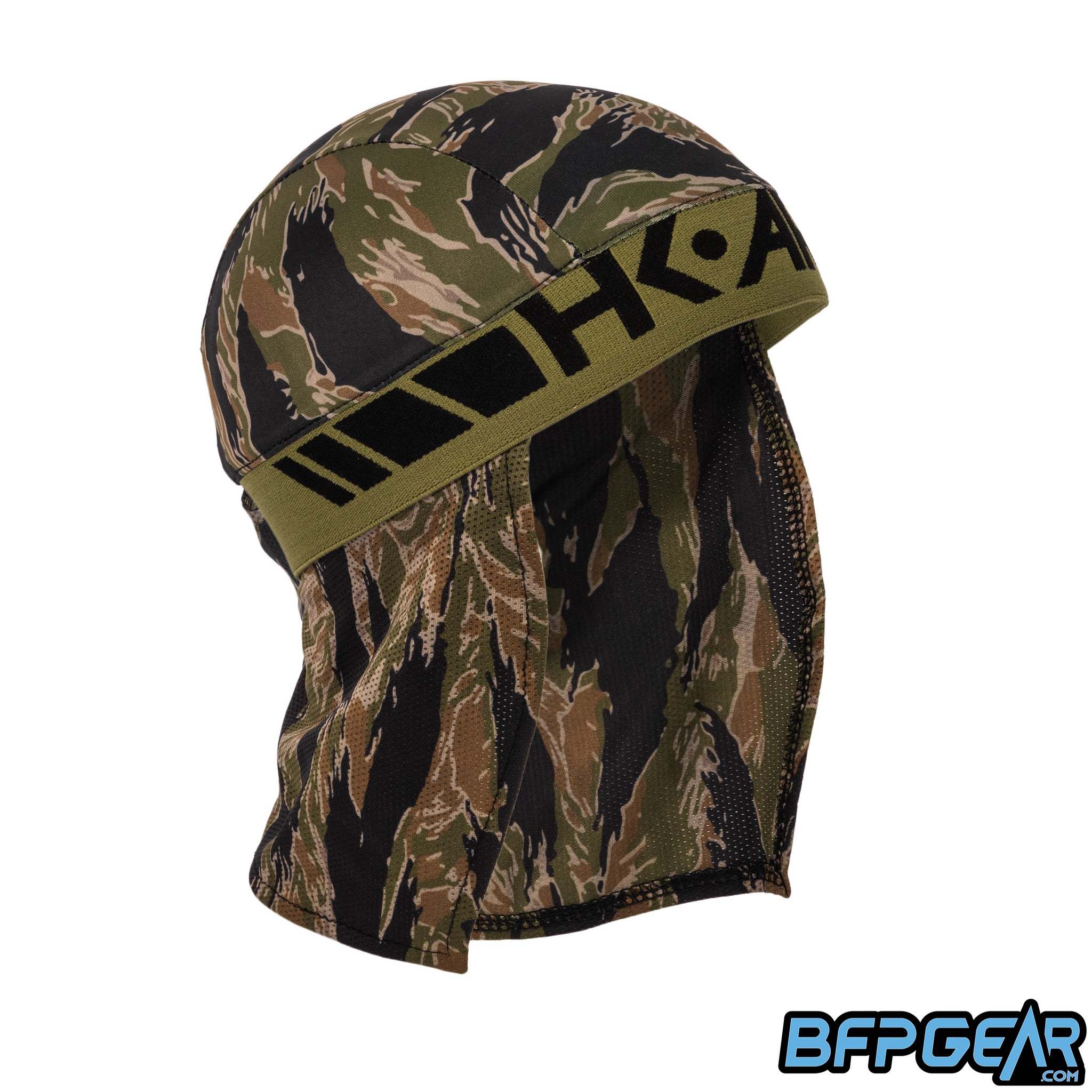 An angled shot of the Tigerstripe Skull Wrap. Black HK ARMY logo is stitched into the olive elastic band.