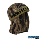 An angled shot of the Tigerstripe Skull Wrap. Black HK ARMY logo is stitched into the olive elastic band.