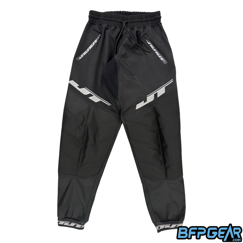 The JT Classic Paintball Pants. All black pants with the JT Logo adorned above the knee padded areas. The ankle cuffs also have the JT logo wrapping around them.