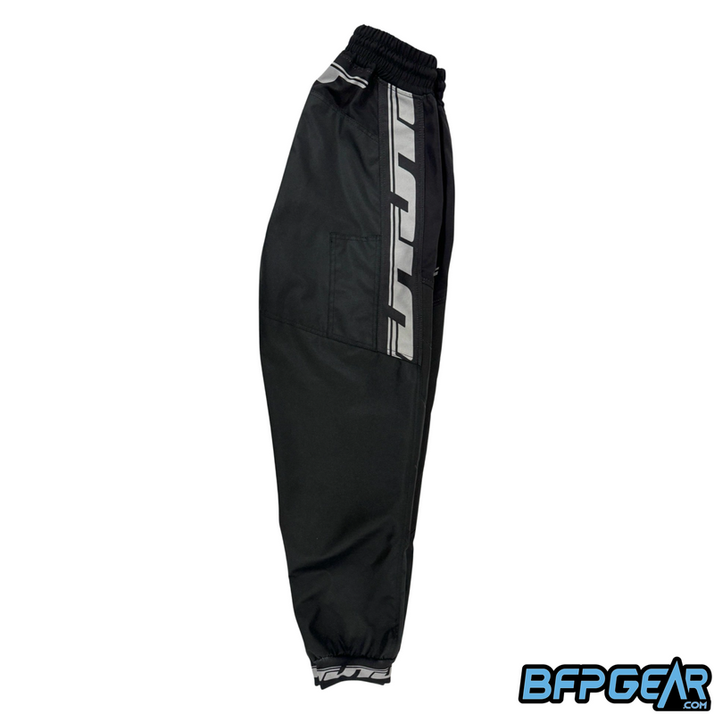 The side view of the JT Classic Paintball Pant. White JT logos go along side the thigh area, down to the knee and cut off there.