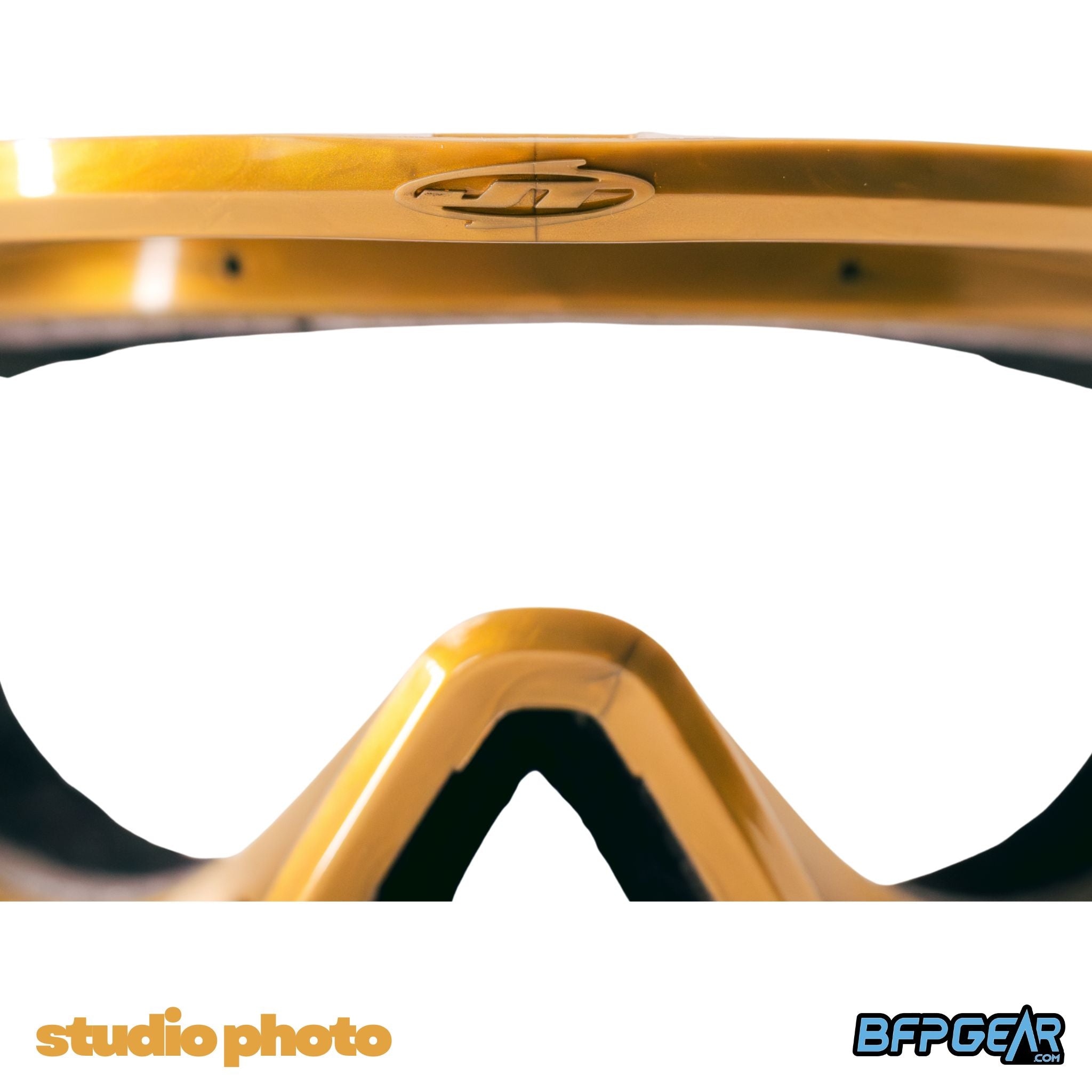 Close-up of the JT logo and Liquid Gold finish on the JT ProFlex LE Thin Goggle Frame