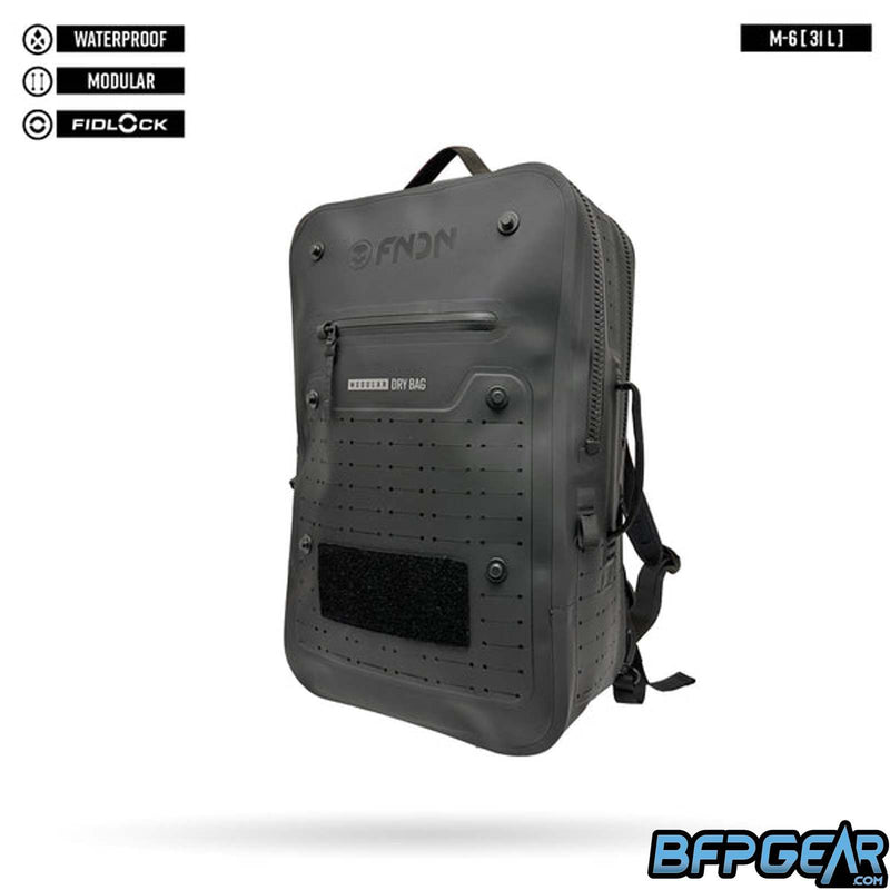 The FNDN M6 waterproof backpack from Infamous paintball. Full waterproof coating with heavy duty zippers, carry handle on top, 6 fidlock pegs for extra bags or pouches, and laser cut MOLLE on the back and sides to secure more items if needed.