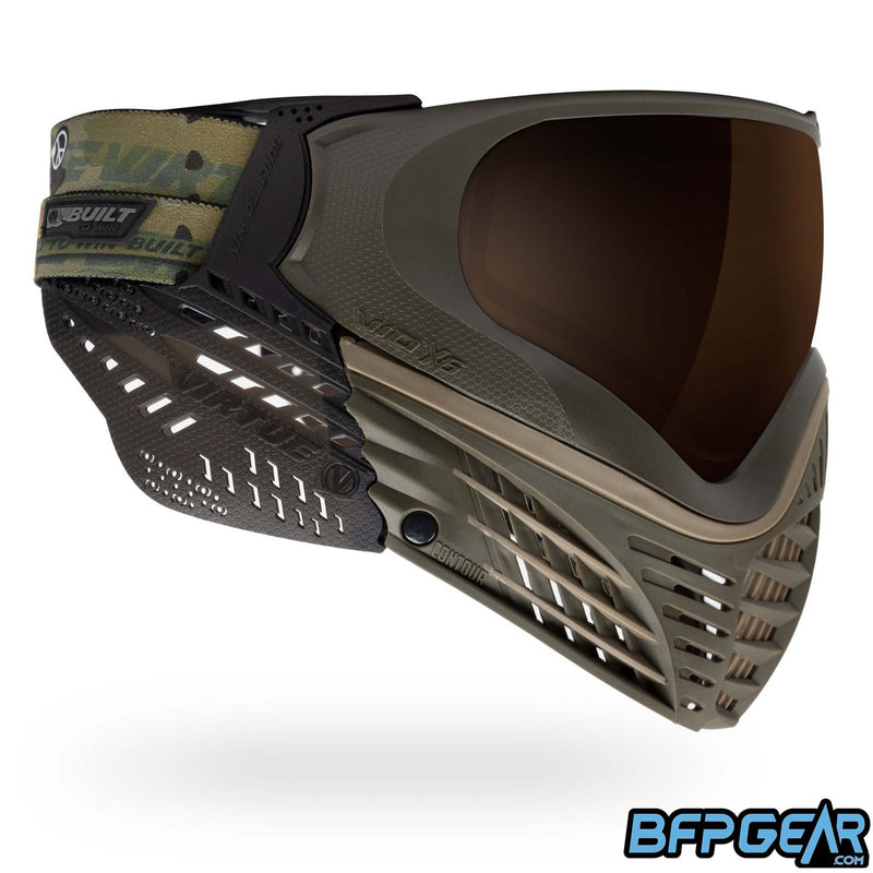A custom color way of the Vio X6 Desert Storm goggle system. Olive faceplate with tan accents and smoke soft ears.