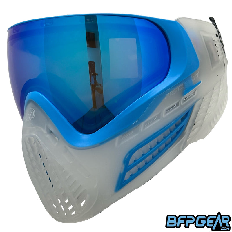 The Virtue VIO Ascend goggle in crystal cyan, facing the left at an angle. This angle shows off the ventilation along the side of the goggle.