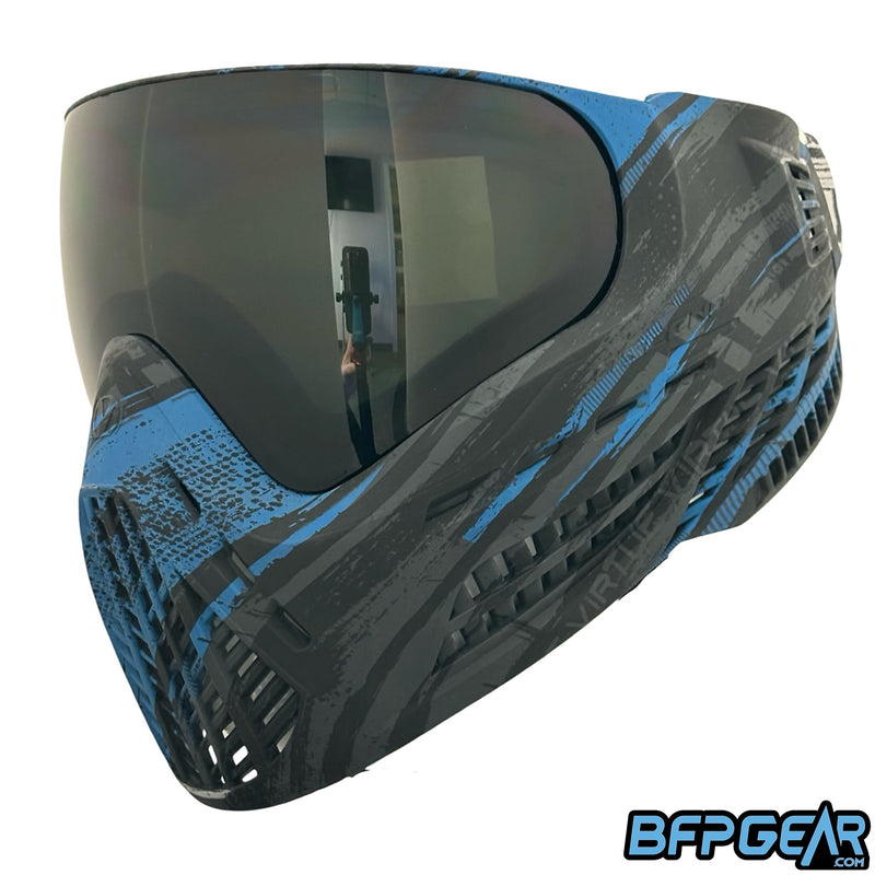 The Virtue VIO Ascend goggle system in the Graphic Cyan color way. Left facing view shows off directed ventilation to help exhaust air as you breathe out.