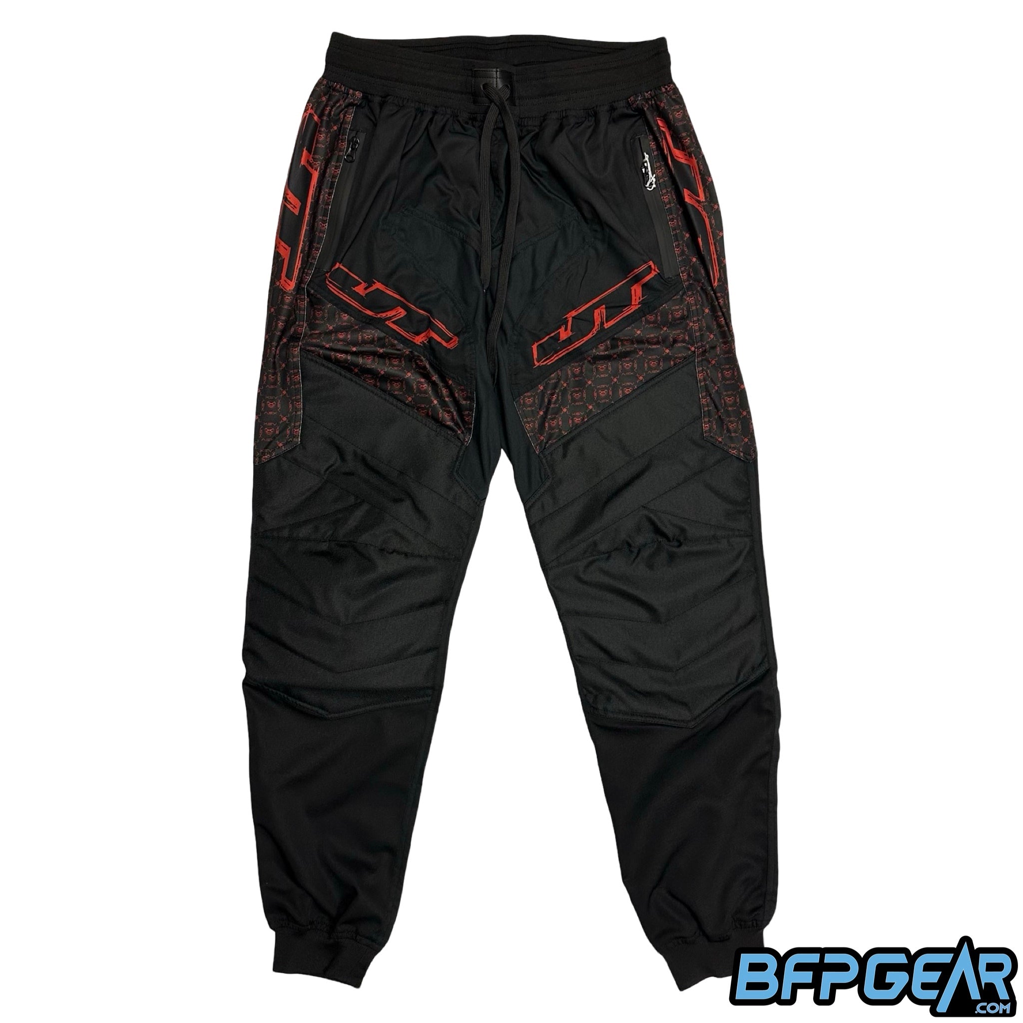 The front of the XSV 24 JT Pro Joggers. Black pants with the red JT Grunge Logo on the sides and above the knee, there's also a patterned design along the pants.