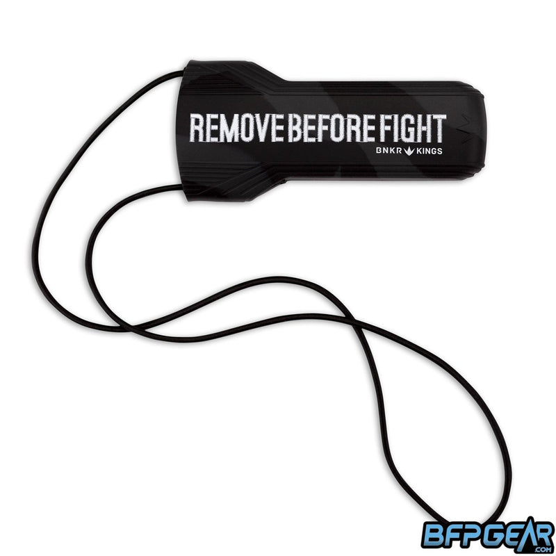 The Evalast barrel cover. All black that has text that reads 'remove before fight.'