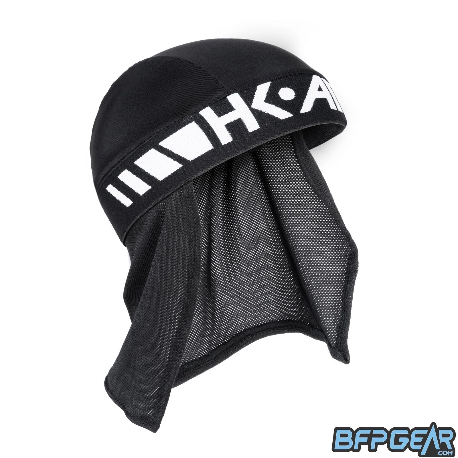 An angled front facing shot of the skull cap in black and white. Shows the elastic band and the mesh lining well. The top of the skull cap is a flexible material to help keep your head warm, or to keep it cool.