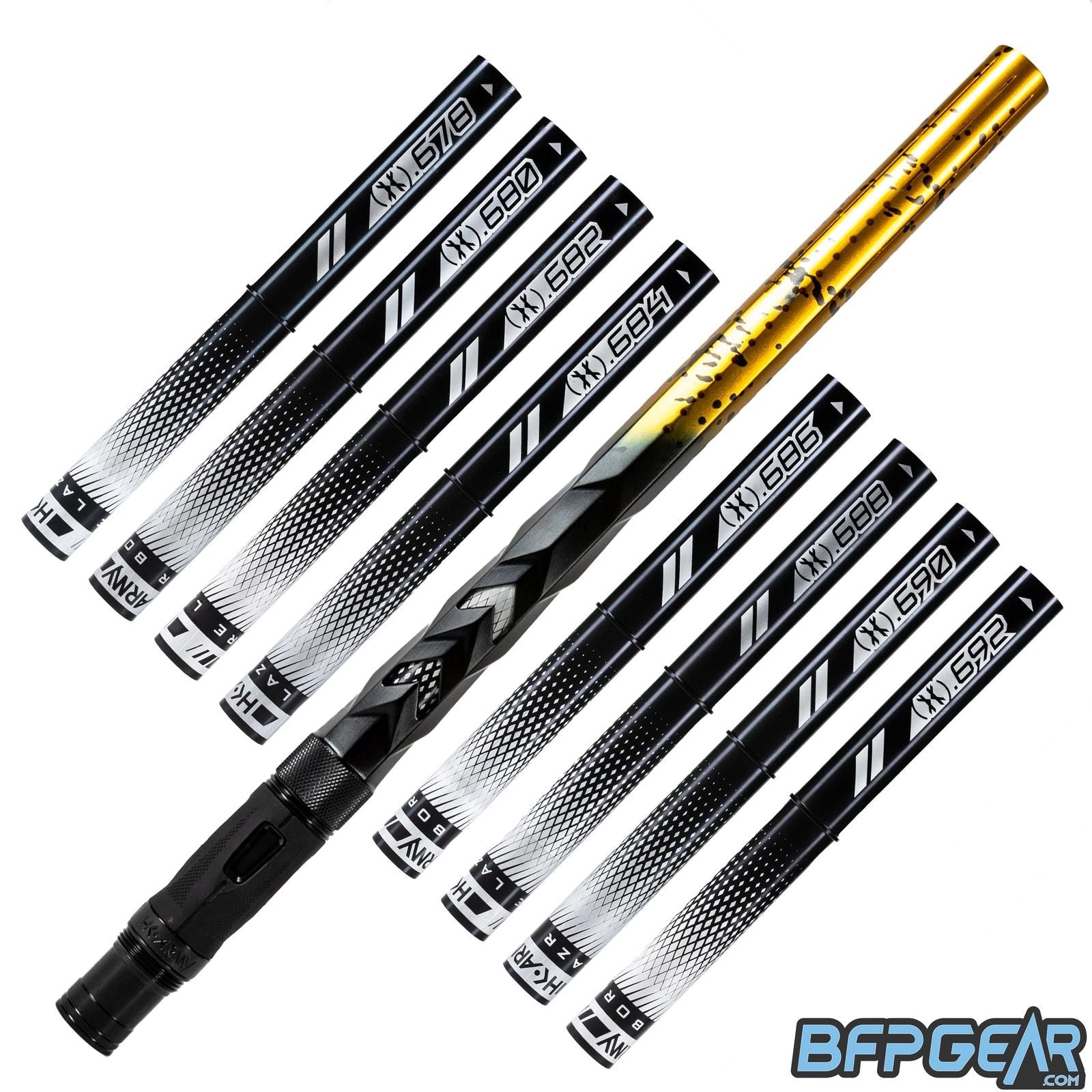 8 black inserts and the Fossil barrel are shown. The Fossil barrel has a unique pattern, the back of the barrel has been milled to look and feel like scales half way the barrel. The front of the barrel has linear porting, both holes and slits. The barrel is black and fades to gold with black splash.