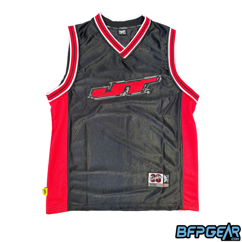 Front facing photo of the black and red basketball jersey. The center has an embroidered JT logo in red. The collar, sleeve trim, and mesh sides are all red.