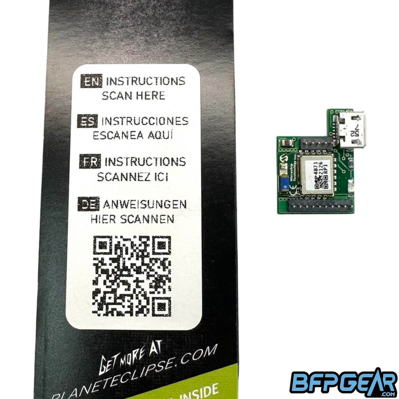 This photo shows the QR code to scan for instructions on how to install the MME comms board along side the MME comms board itself. Instructions come in English, Spanish, French, and German.