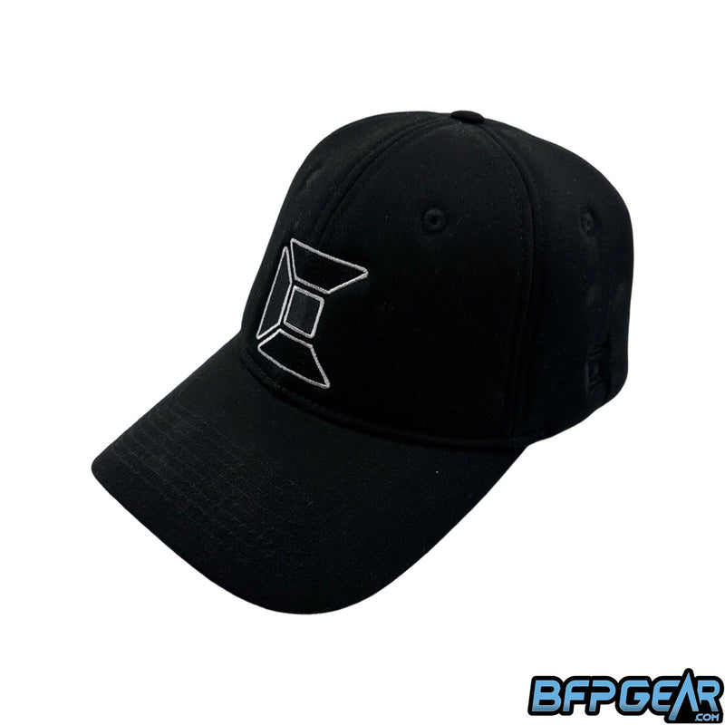 The Exalt Bounce Hat in black. Looks like a standard baseball hat, but the material is high density foam to help soften the impact of incoming paintballs.